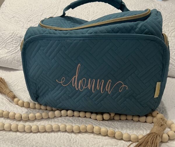 A blue bag with the name donna on it