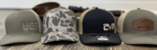 A close up of two hats on top of a table.