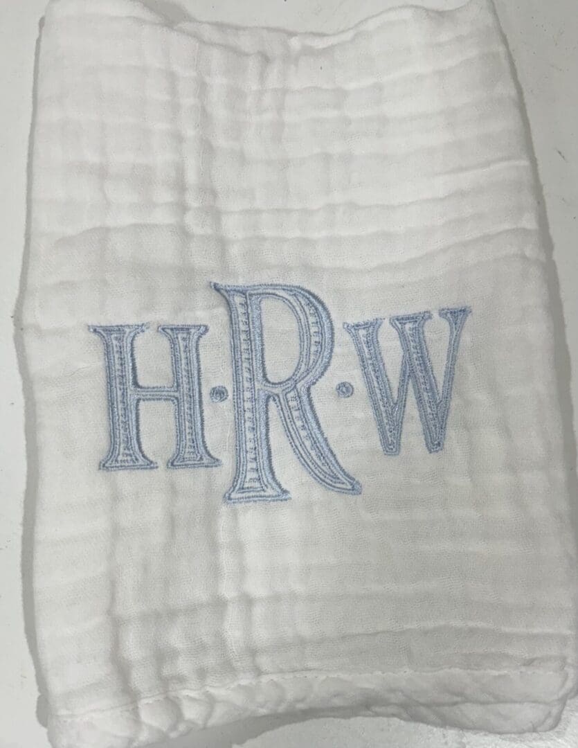 A white towel with the initials h. R. W on it