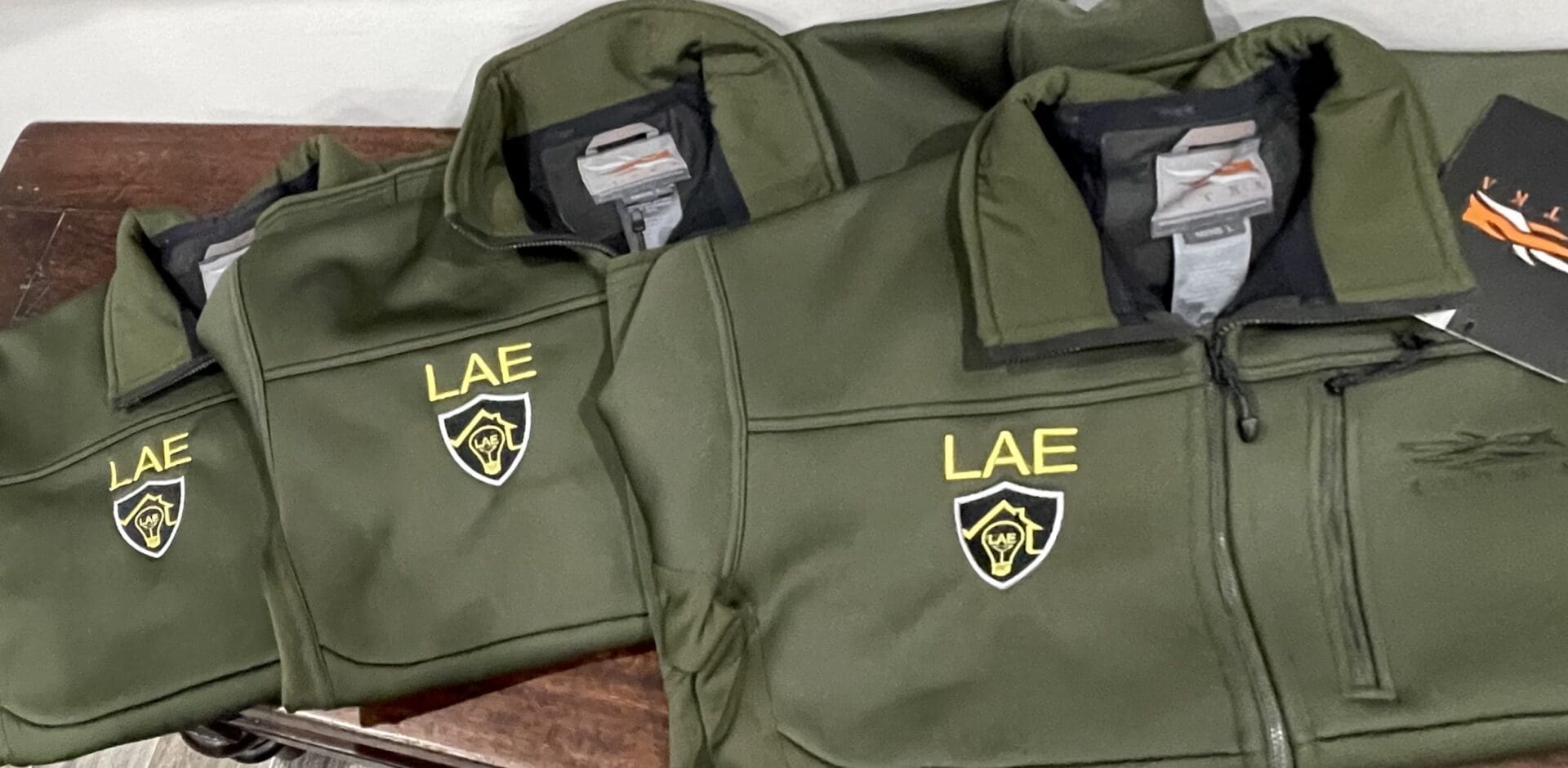 Two jackets with the letters lae on them.