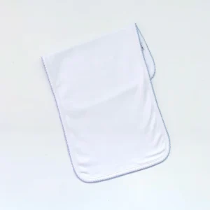 A white towel on top of the floor.