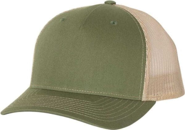 A green and tan hat is on the ground