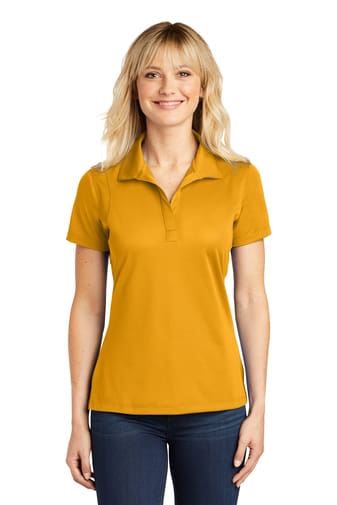 A woman wearing an orange polo shirt.